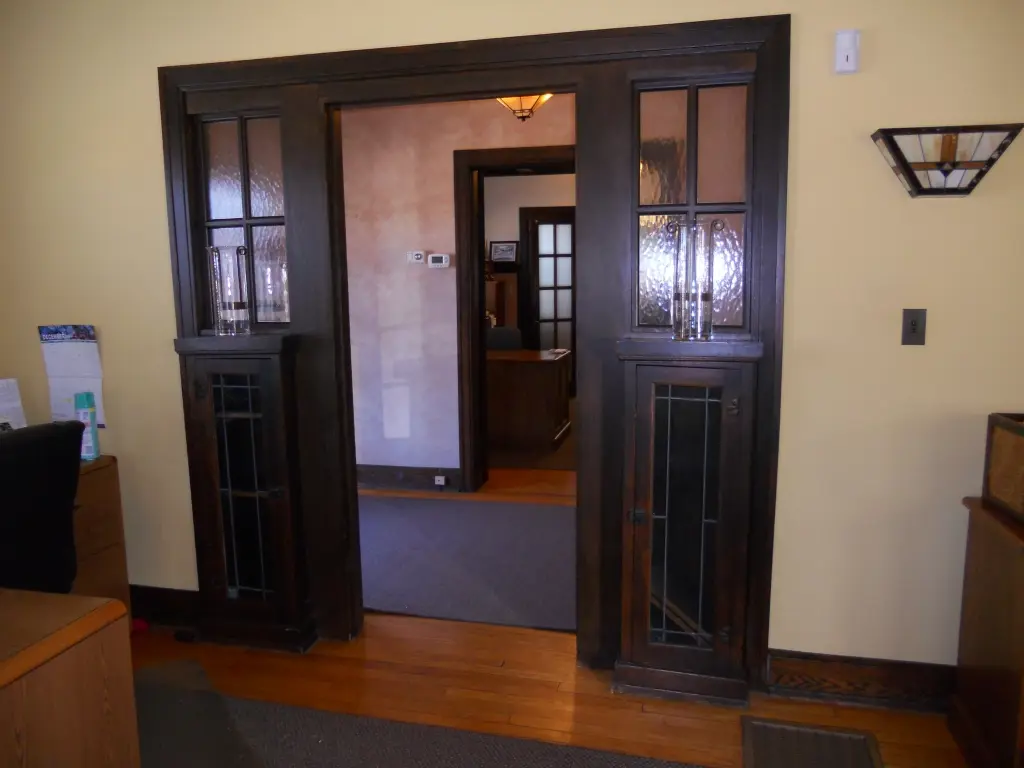 Colonnade doorway shown from the living room side.